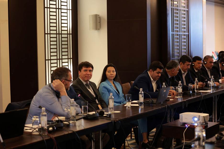 A group of people sitting at a long table AI-generated content may be incorrect.