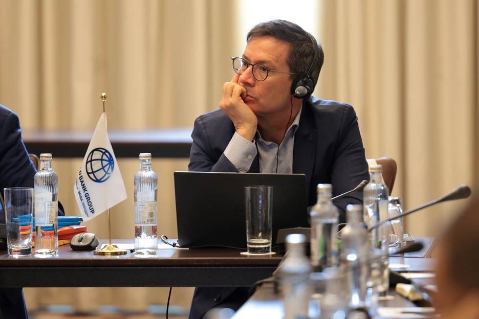 A person wearing headphones and holding his chin AI-generated content may be incorrect.